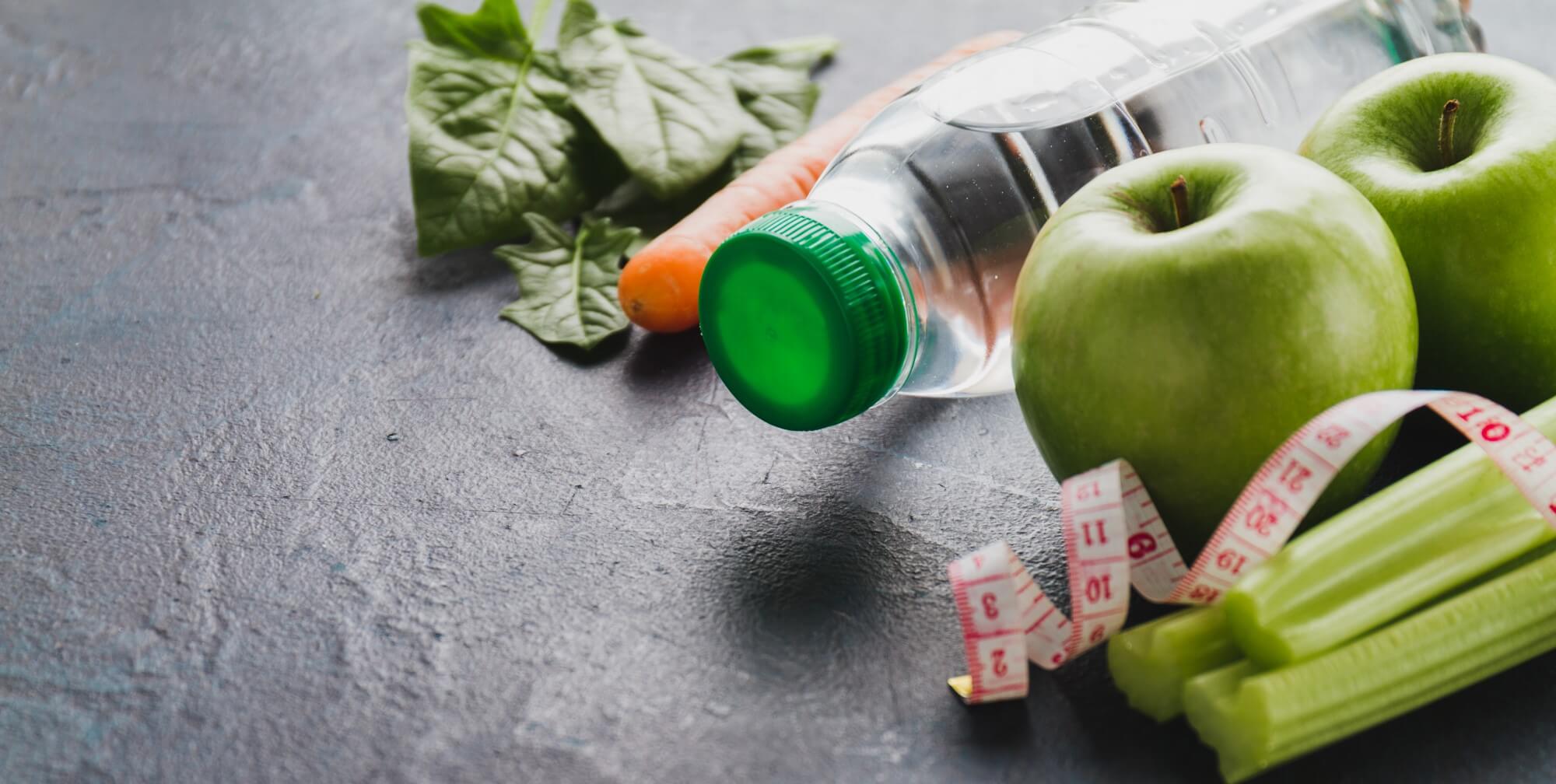 close-up-healthy-food-with-water-bottle-tape-measure (1)